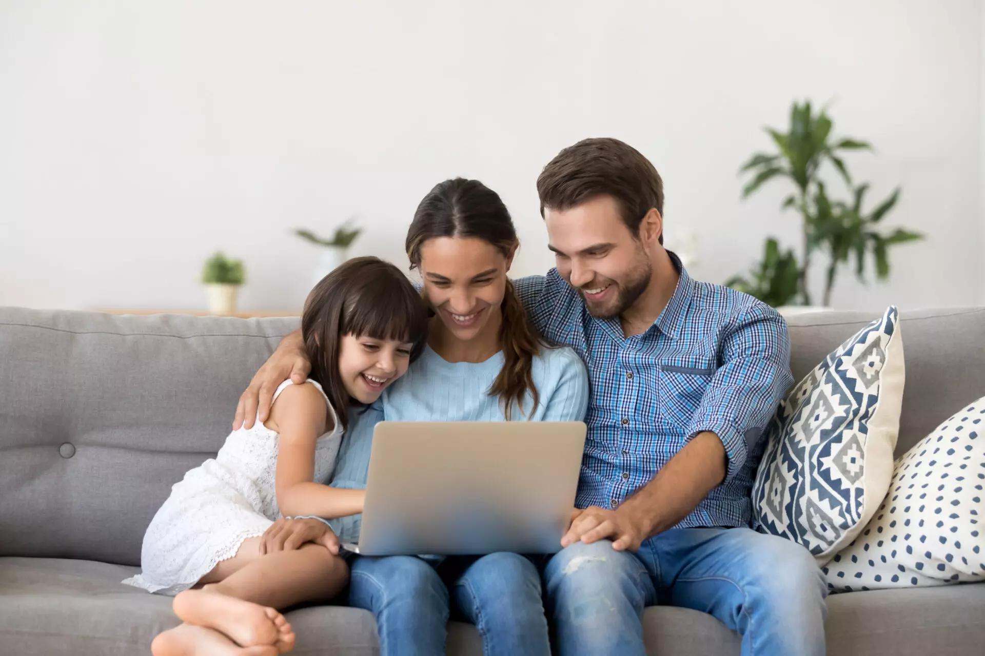 family of three on their computer looking at biblically responsible investment pools