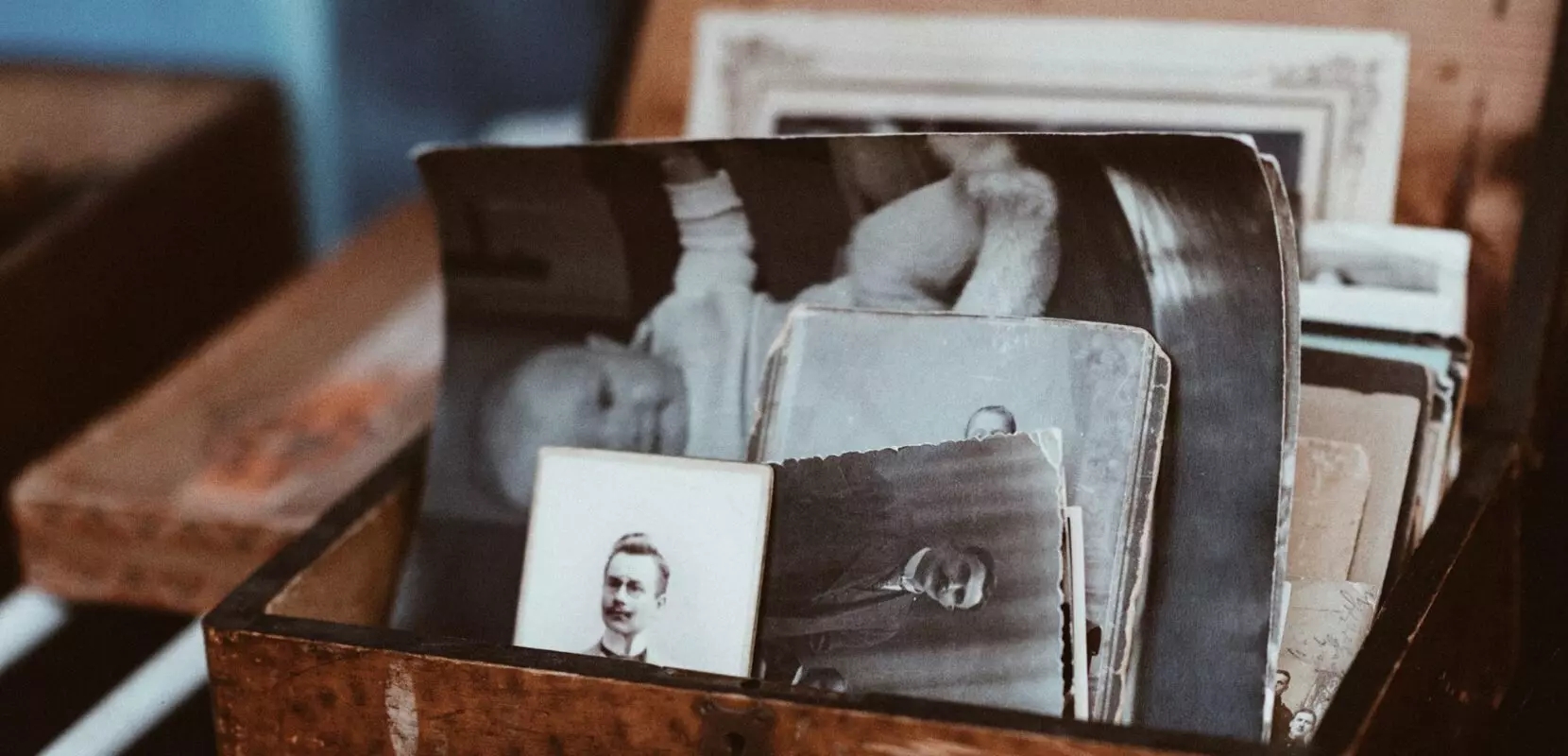 a box of old black and white family photos
