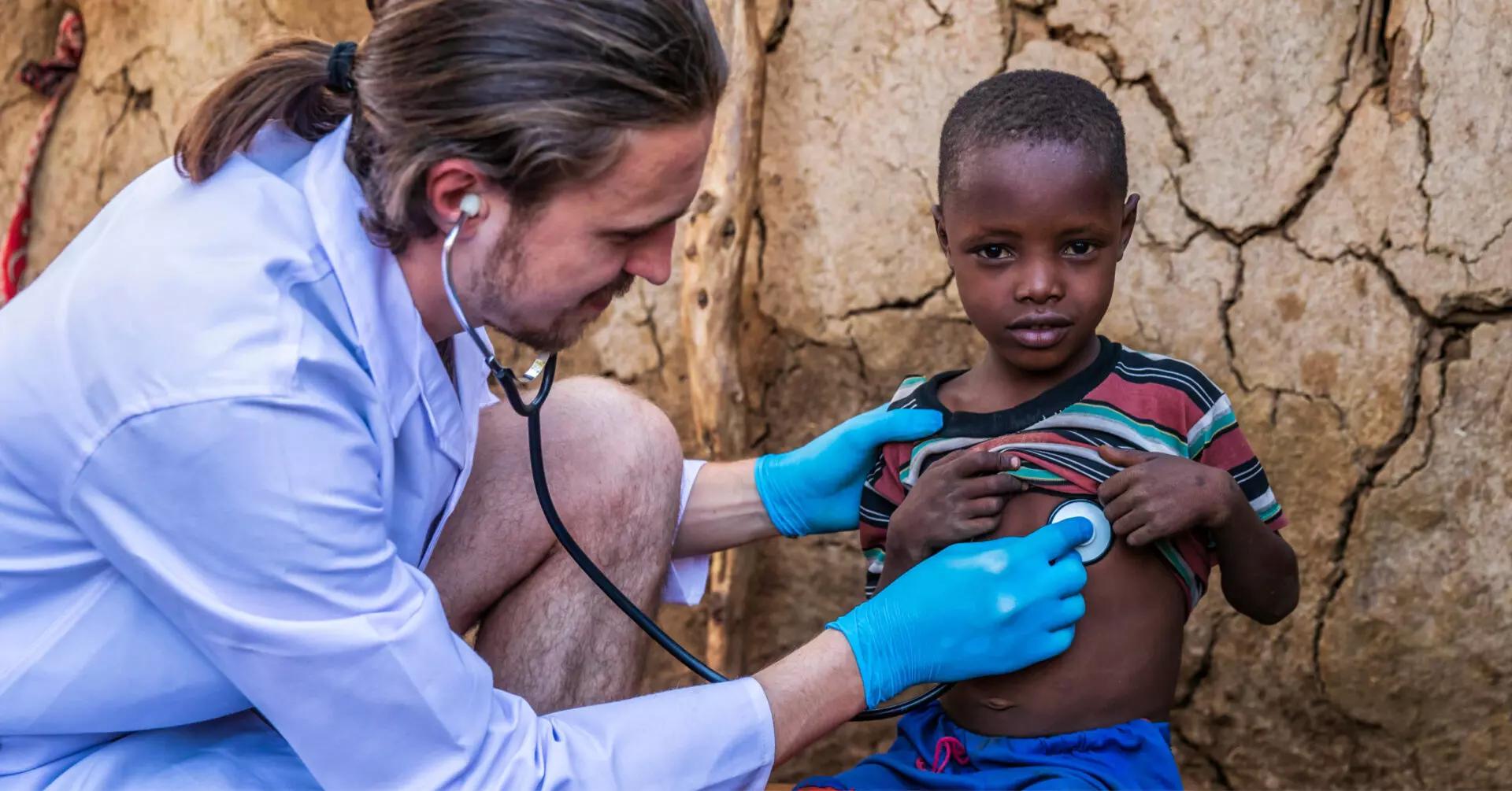 doctor checking the health of a young child